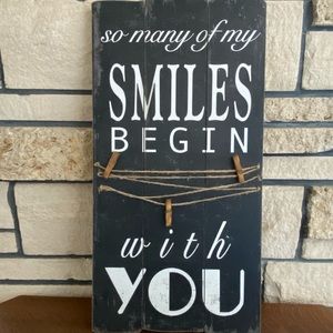 SMILES sign with photo clips